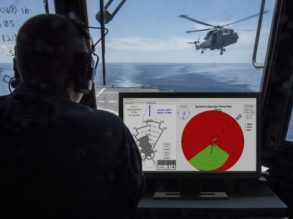 Helicopter over ship