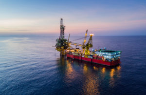 aerial of oil rig in ocean